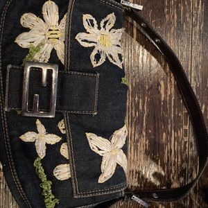 FENDI
Leather-Trimmed Denim with straw flowers